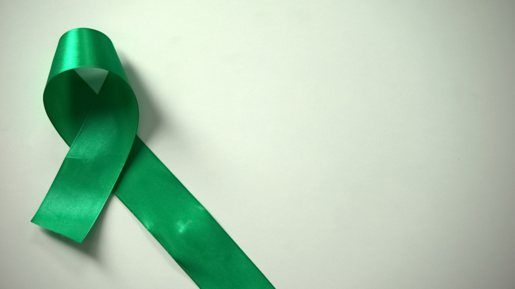 An image of a green ribbon which represents mental health awareness