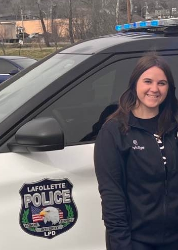 Shannon from CivicEye standing in front of a Lafollette cruiser